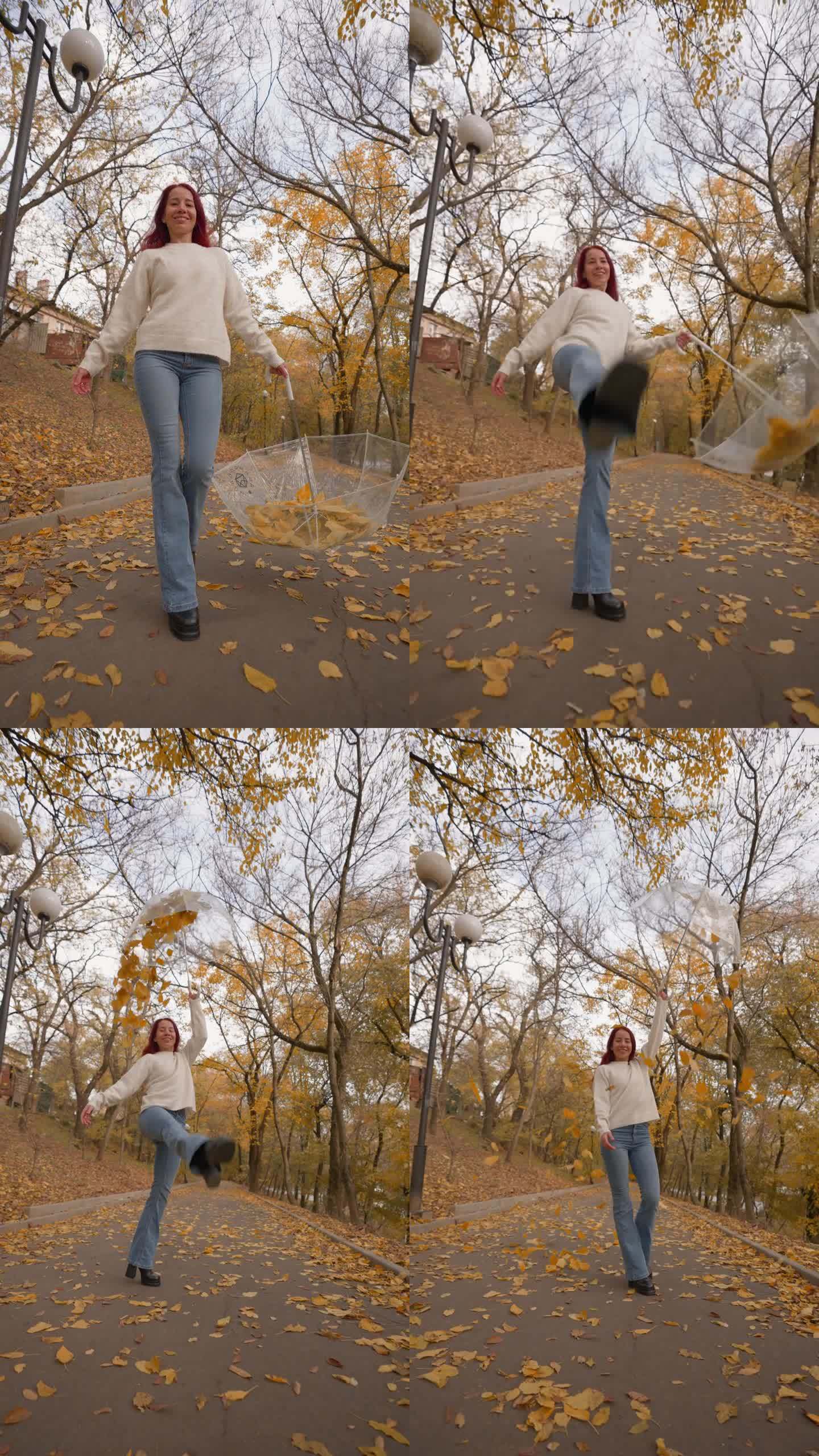 快乐的女人把腿抬成两条腿，撑起一把伞，秋叶飞扬