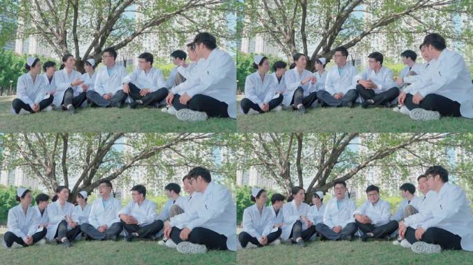 一群医生坐在草坪上