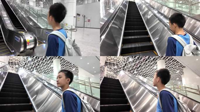 地铁自动扶梯上的男孩