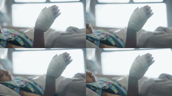 一个病人在医院里用盐水扎了手。