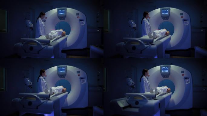 在医学实验室，放射科医生在病人接受手术时控制MRI或CT或PET扫描。专业女医生运用先进的医疗技术进
