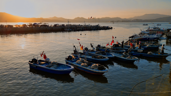 夕阳大海渔船渔民渔村