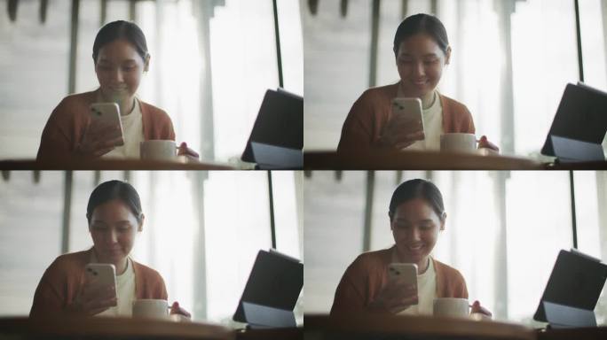 女人在咖啡馆用智能手机