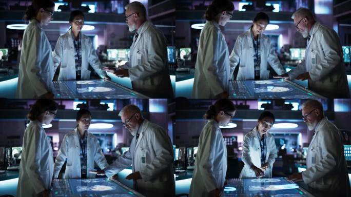 现代医院医学研究中心:不同的同事聚集在交互式触摸屏桌旁，屏幕上显示着大脑的CT扫描。医生讨论中风后的