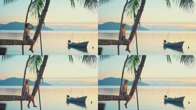 一个女人坐在沙滩上的椰子树上