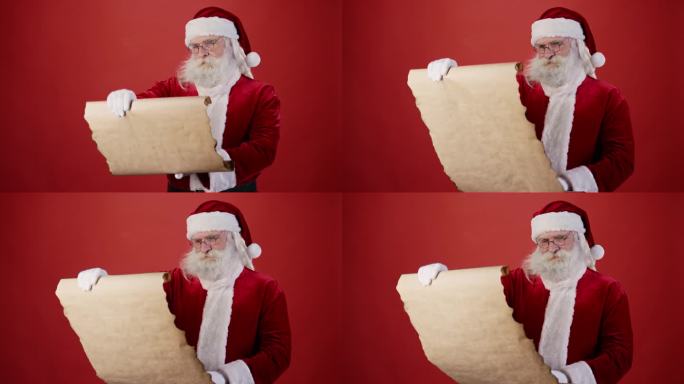 微笑的圣诞老人阅读愿望清单和点头