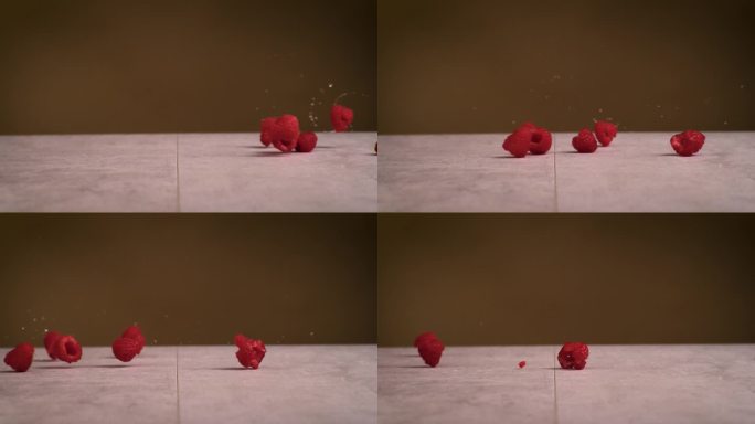 树莓在超级慢动作中滚动。高速摄像机拍摄到覆盆子在地上滚动的画面。