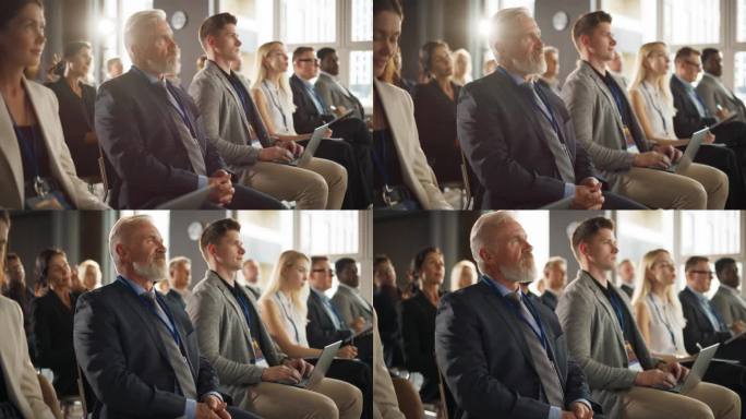 资深白人男性企业家坐在商业论坛的不同人群中。成功的投资者聆听演讲人在舞台上推销创业点子。参加技术会议