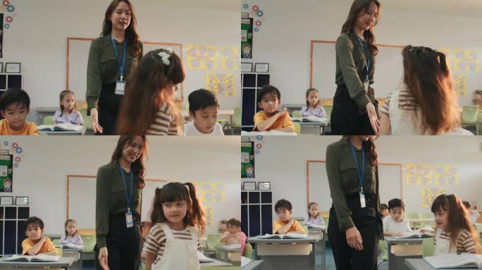 图为，在小学讲课的快乐女教师走过教室。