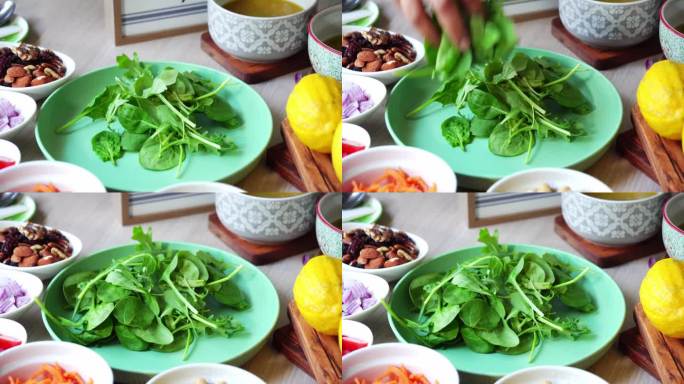 沙拉盘中加入菠菜叶、坚果、杏仁、柠檬、南瓜子、西红柿叶、菠菜酱