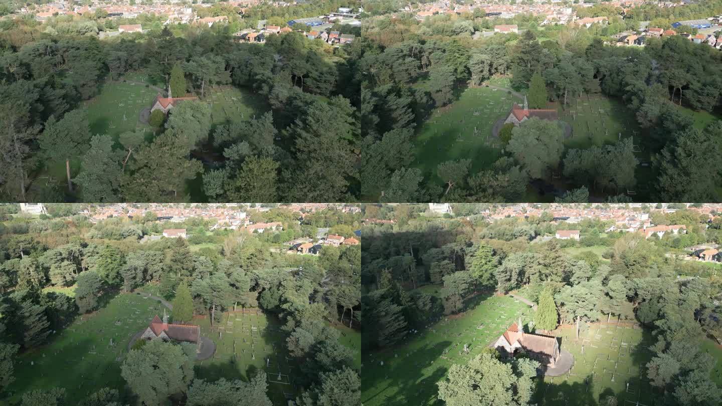 在英国英格兰诺福克郡的怀蒙德姆，树木环绕的怀蒙德姆公墓全景鸟瞰图。