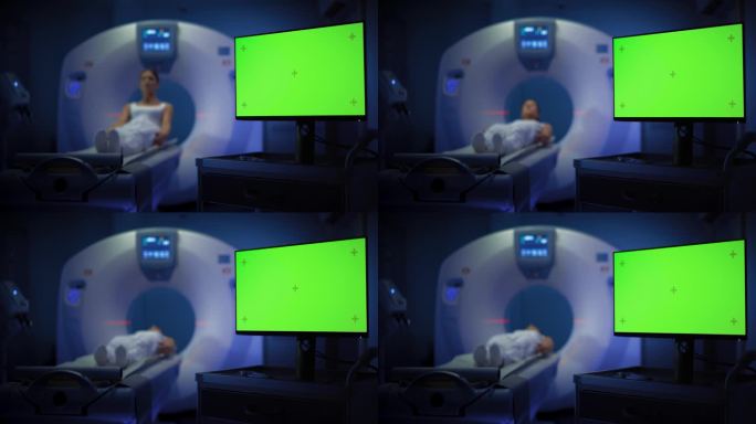 一名女性患者在CT或MRI高科技设备上接受脑部扫描的中景。显示显示器显示绿色屏幕模型模板。医学实验室