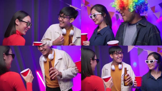快乐的亚洲多元群体的朋友在聚会上与啤酒瓶碰杯霓虹灯。在家里聚会，朋友们一起唱歌跳舞。微笑的男人和女人
