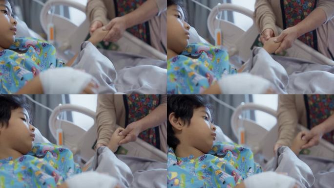 患流感的男孩躺在医院的病床上，他的手连接着输注生理盐水的软管。