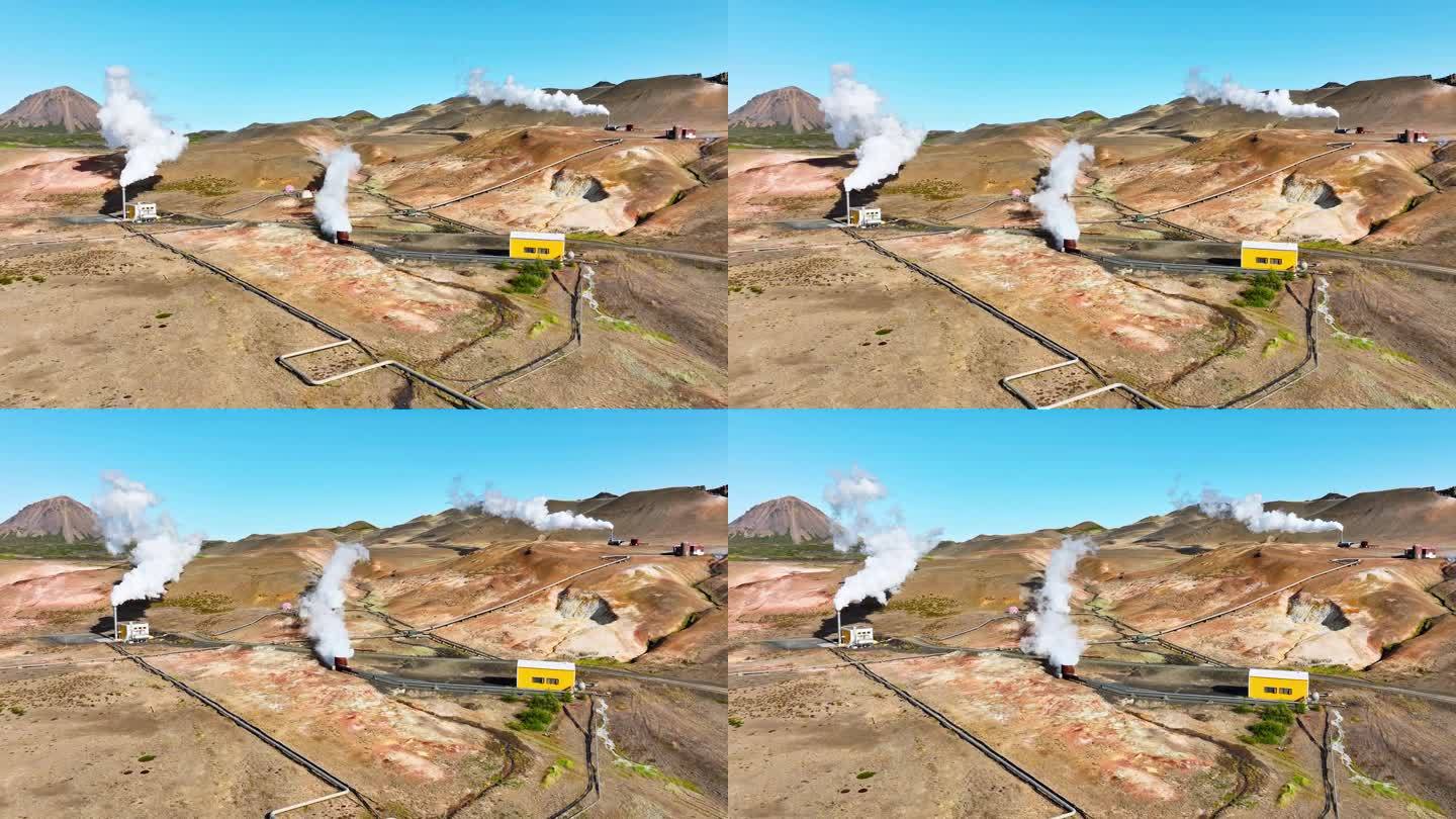 现代地热能发电厂工作，工厂工作与烟雾，位于风景如画的冰岛火山景观。