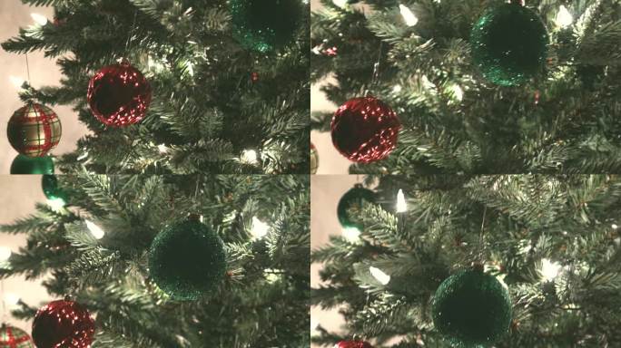 近距离拍摄缓慢移动的圣诞树上的彩灯和球