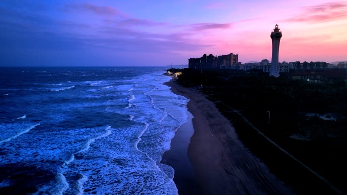 夕阳海边夜色灯塔沙滩