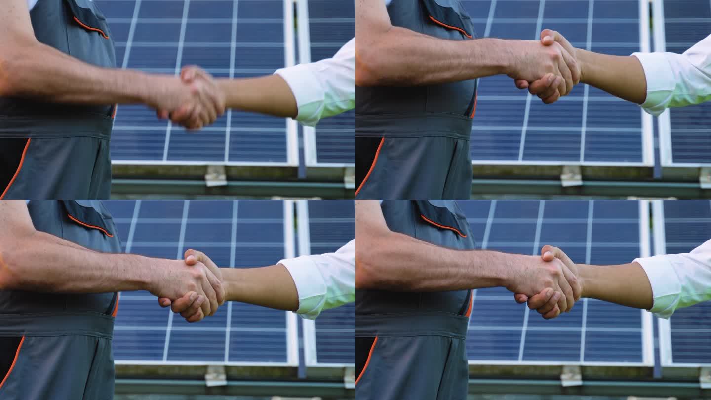 两位工程师，印度经理和高级下属在讨论完光伏太阳能板的背景后握手，拉近距离