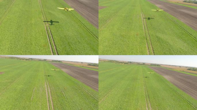 FPV无人机捕捉小型作物喷粉机掠过农村机场的草地起飞区