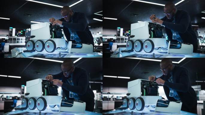 一位非洲工程师在开发遥控送货机器人时使用螺丝刀的肖像。拥有现代化设备的高科技研究实验室的黑人专家