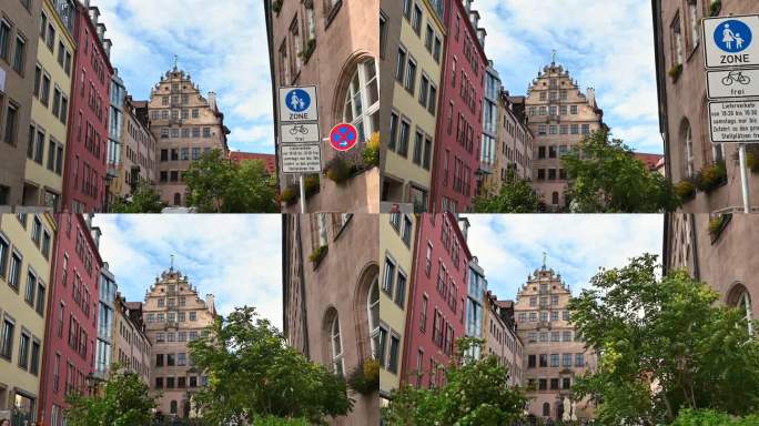 编辑使用。2023年8月1日，德国纽伦堡。在历史中心的视角镜头，仰望建筑物的结构。我们可以看到一些人