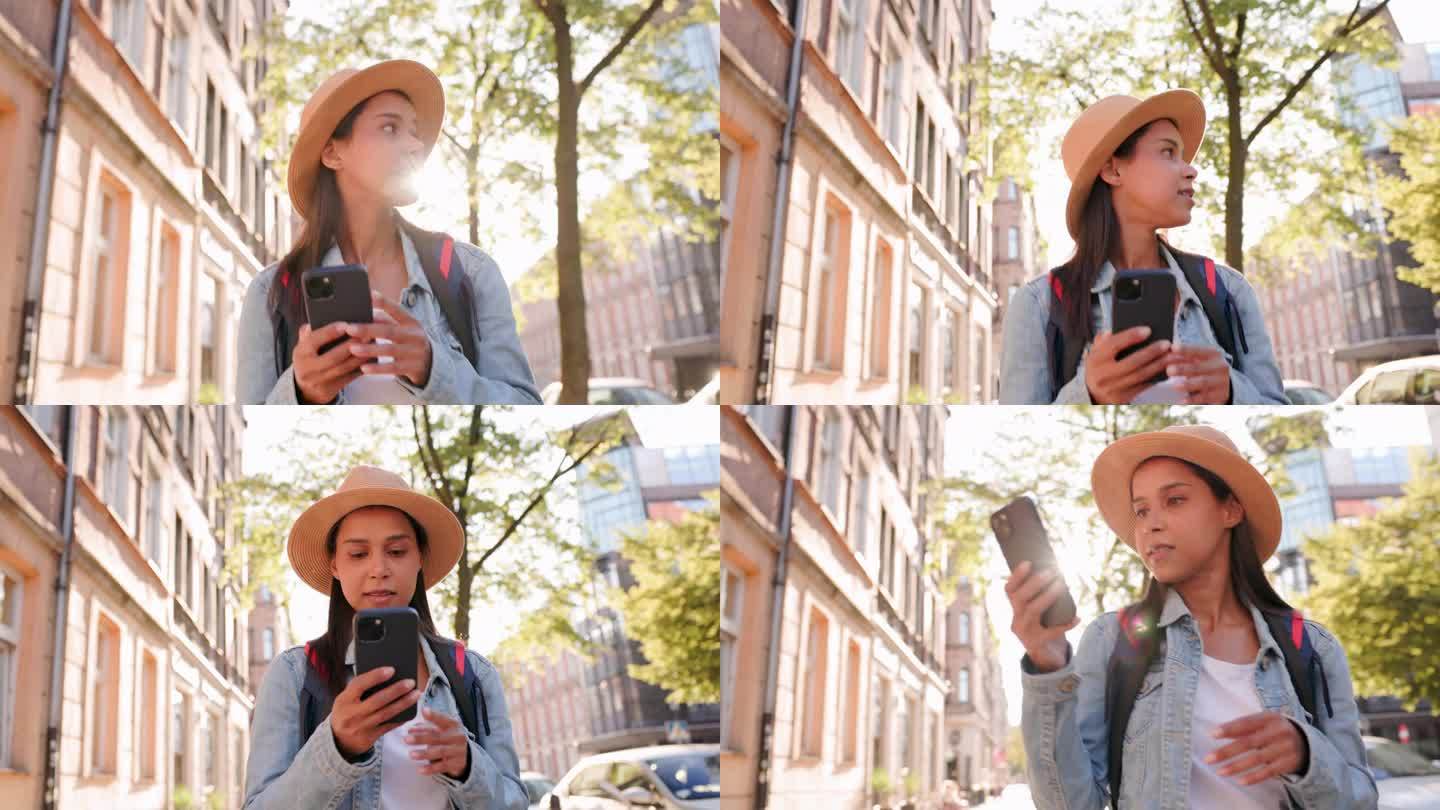 女游客在城市观光中使用手机