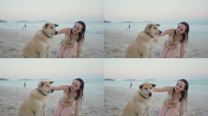 度假期间，女人在海滩上与狗狗休息