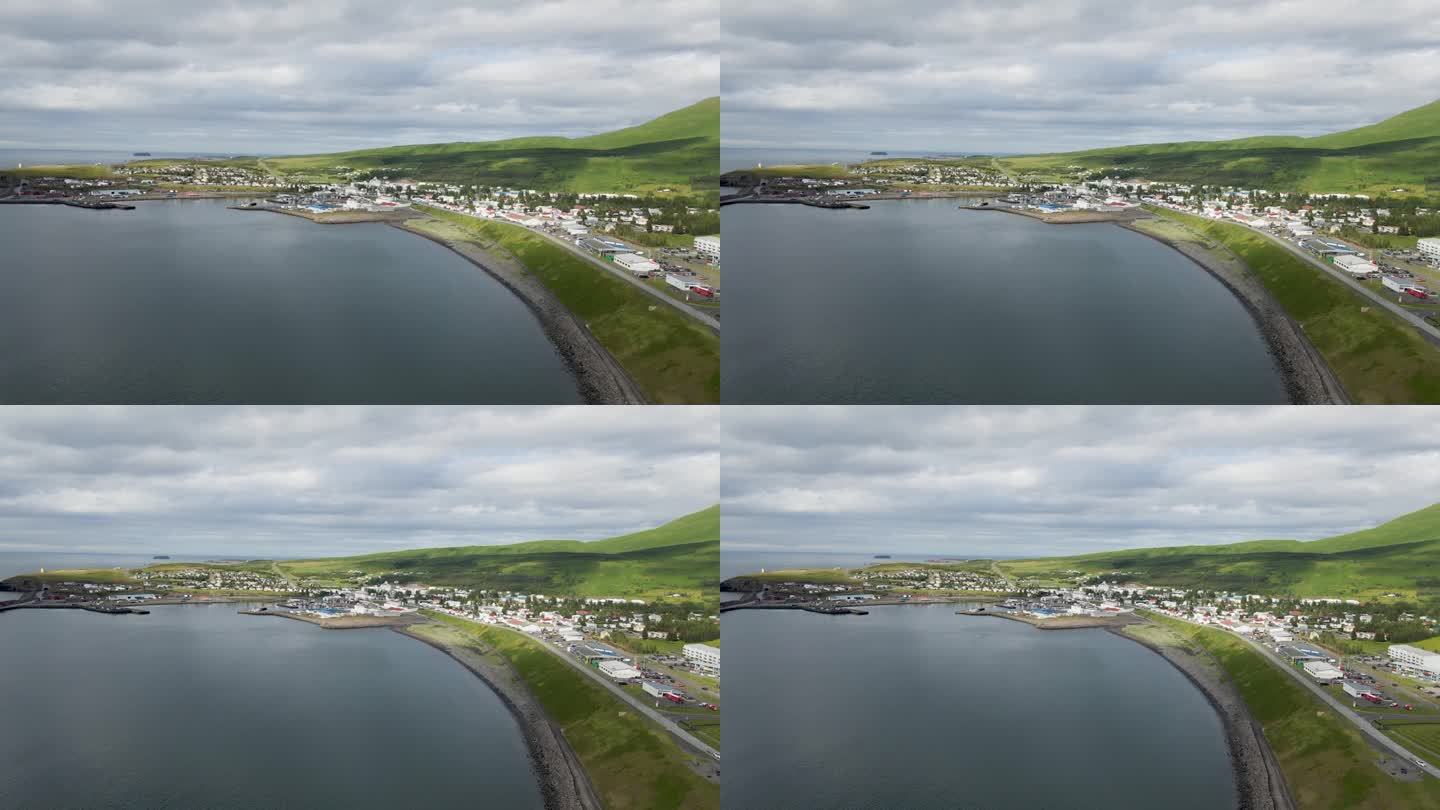 在这个4K无人机扫描中，从上面拥抱Húsavík，捕捉城镇的全部魅力，由孕育其海岸的宁静水域构成。