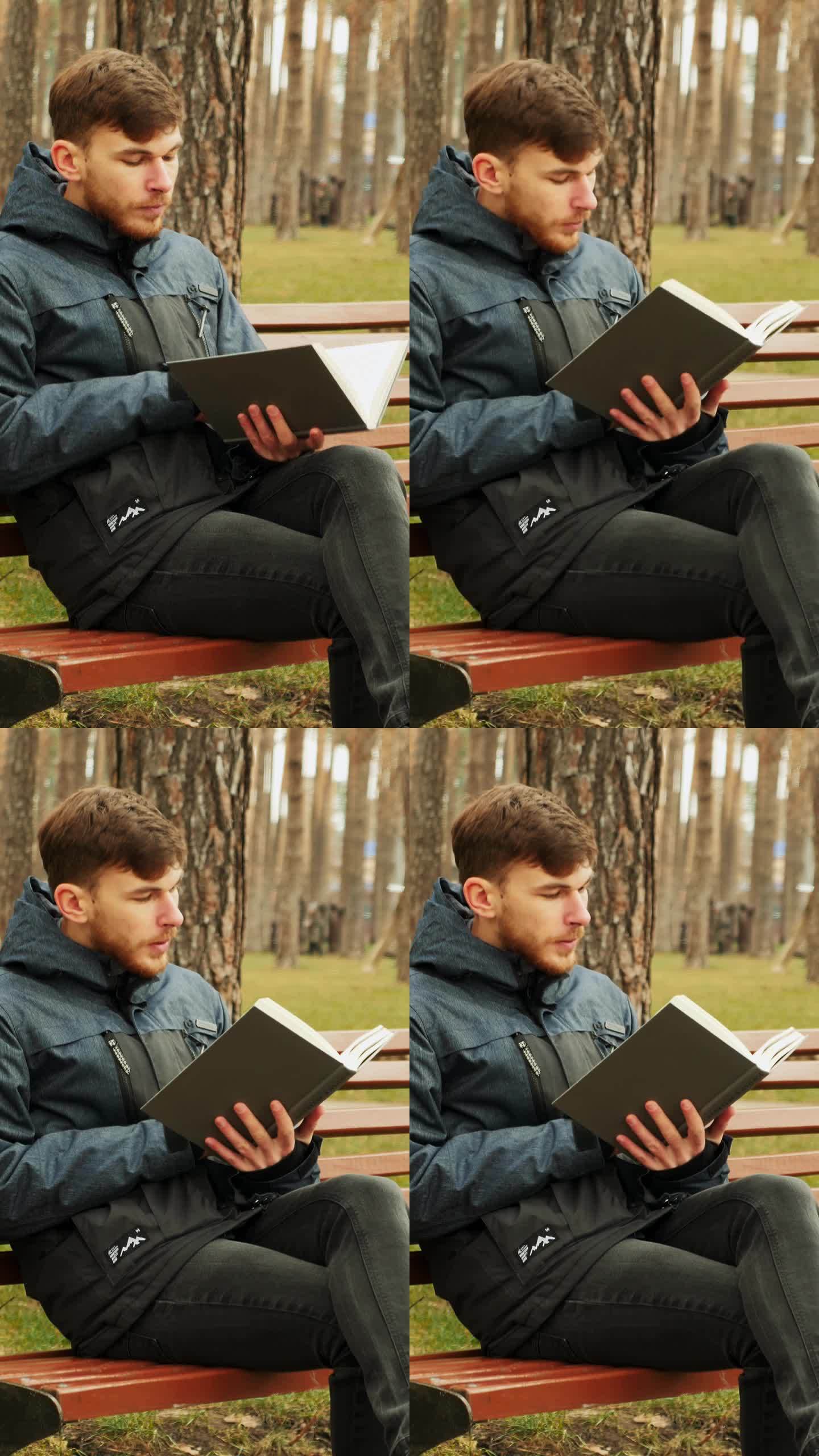 男人坐在长凳上，打开书，翻页，开始阅读。垂直视频
