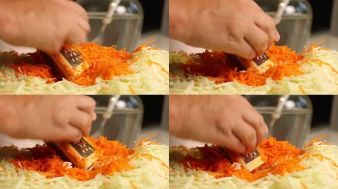 一个男人在家煮酸菜。磨胡萝卜。特写，从侧面看…