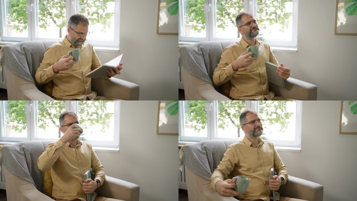 白人中年男子，坐在扶手椅上，看书，喝咖啡