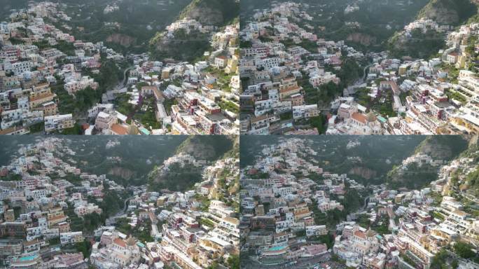 反向无人机拍摄显示波西塔诺镇建在阿马尔菲海岸悬崖