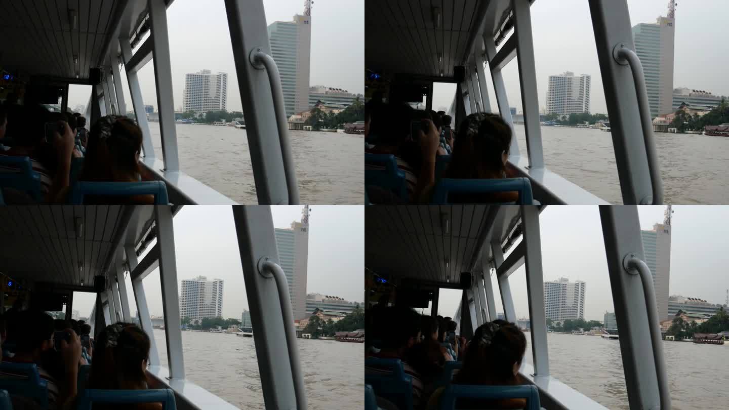 人们在曼谷河上乘坐轮渡上下班