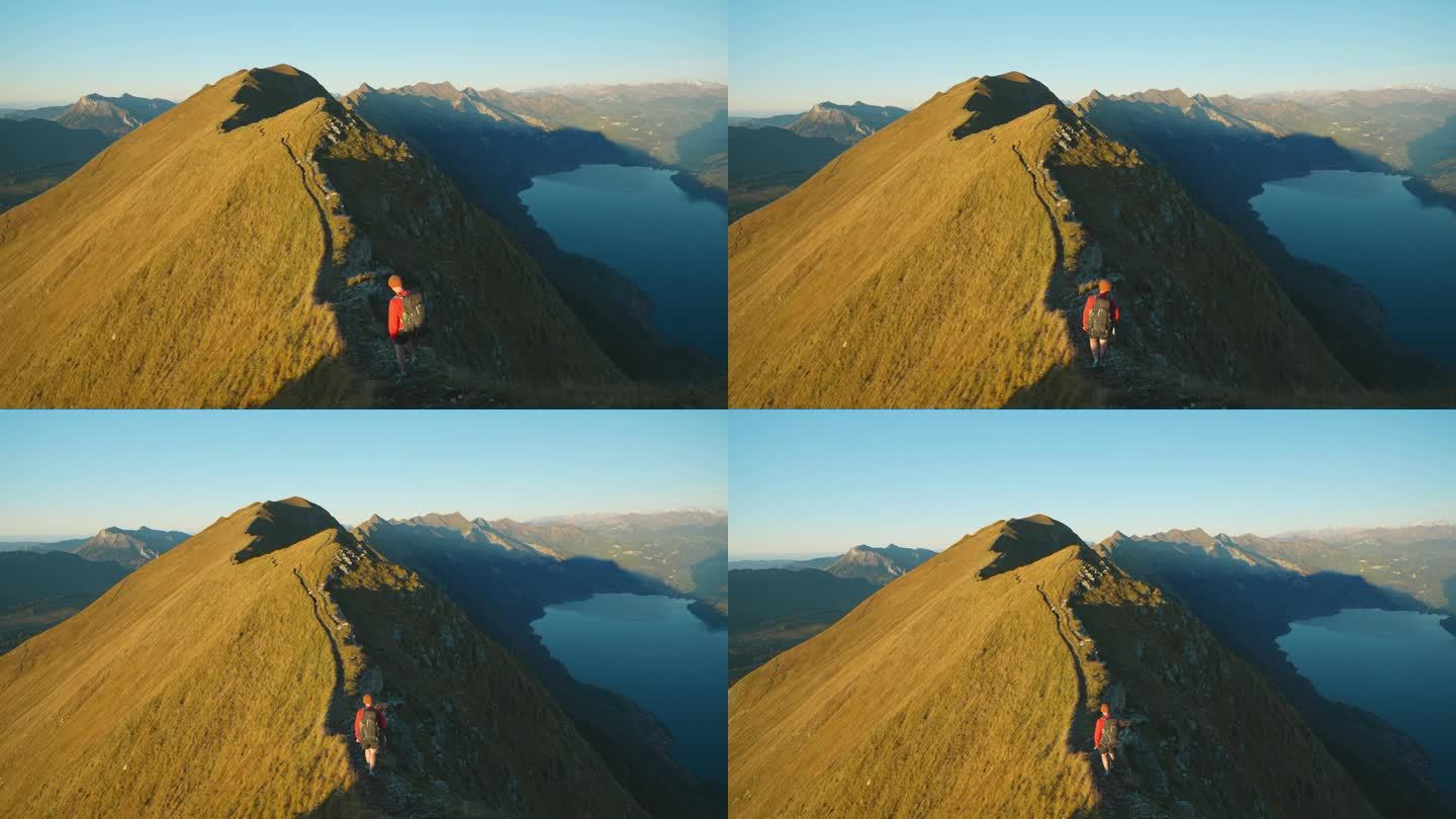 一名男子在瑞士阿尔卑斯山的因特拉肯徒步旅行