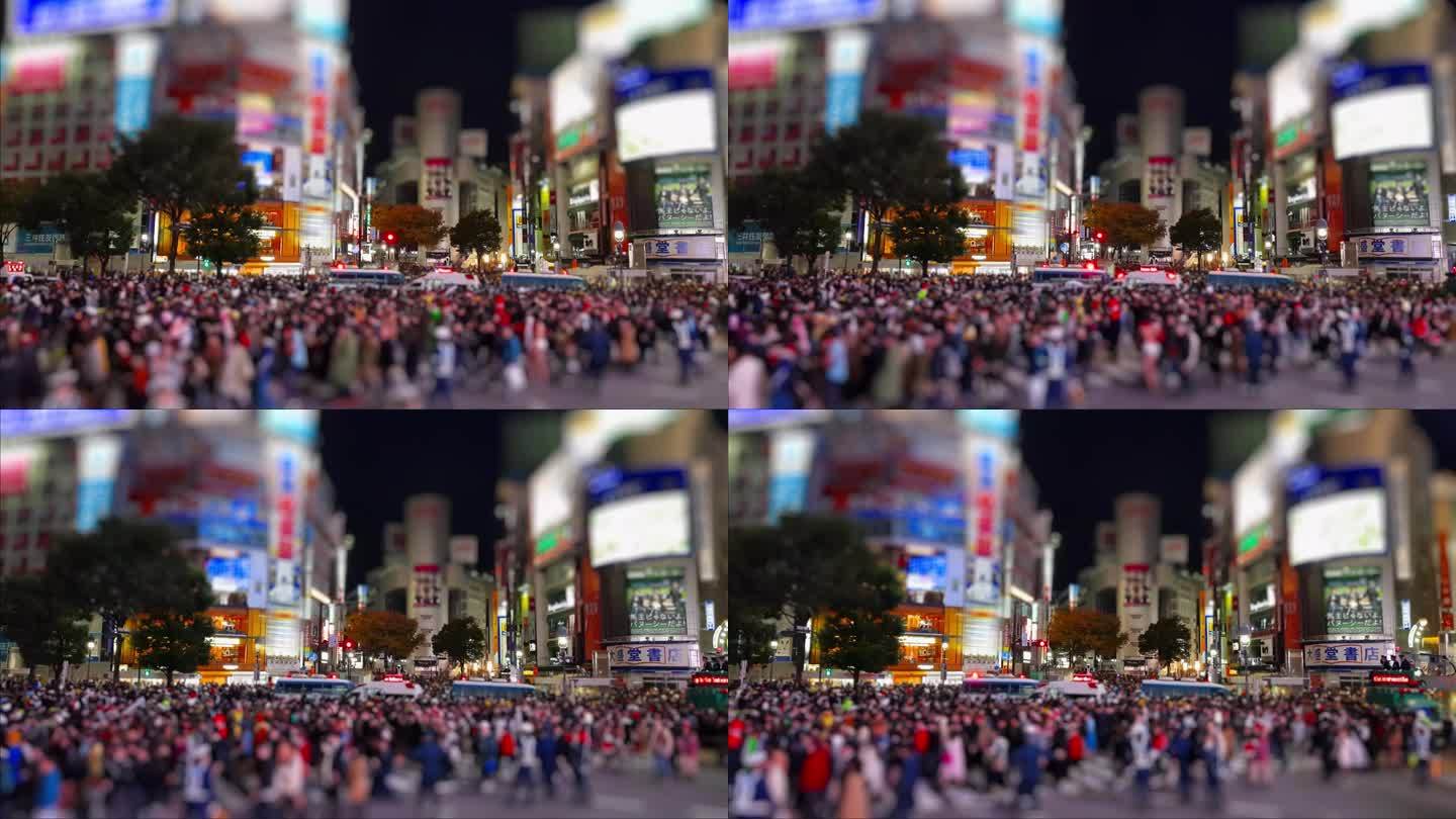 东京街道上的人群。建筑物上的大型空广告显示屏