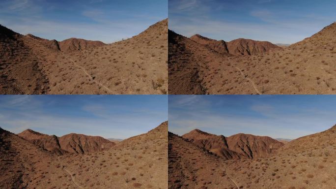 科尔特斯海洛杉矶湾附近的下墨西哥红棕色沙漠景观中的摩托车航拍图