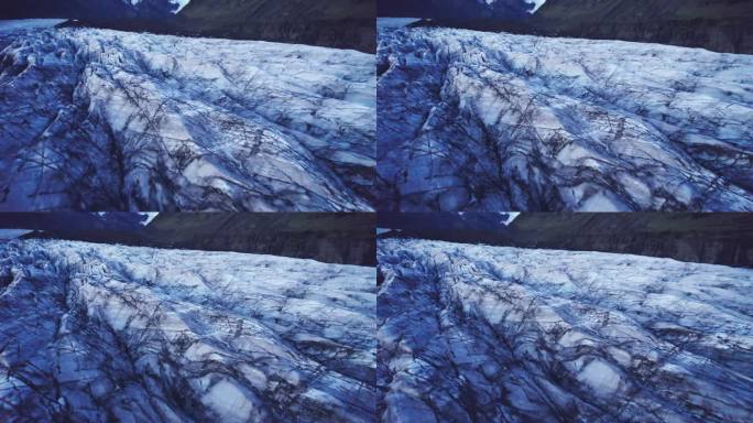 航拍:与冰川蜿蜒的路径相反，有深深的裂缝和锯齿状的冰层，这是气候变化对这个自然奇观不断移动和转变的影