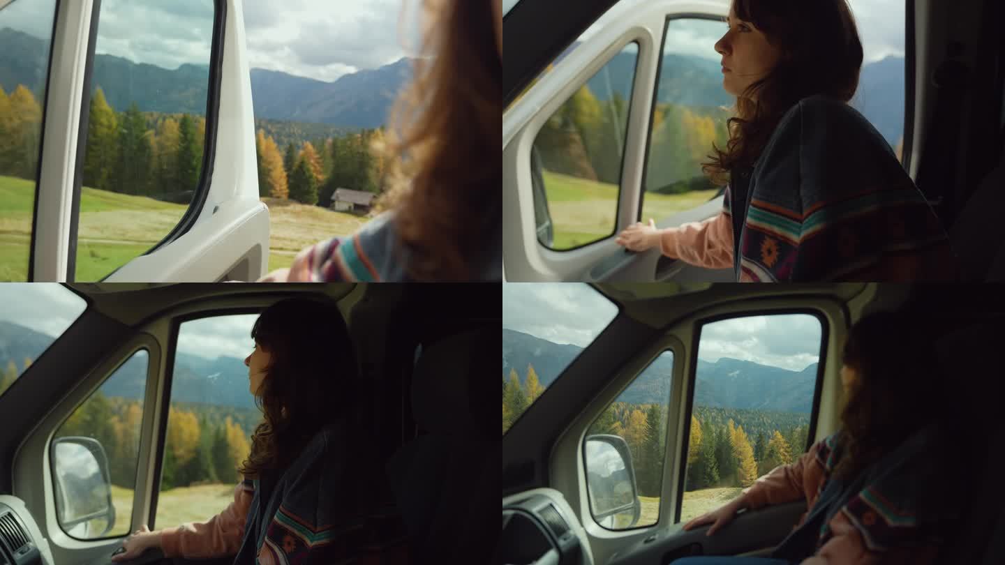 一名女子坐在副驾驶座位上，看着秋天白云石的美景