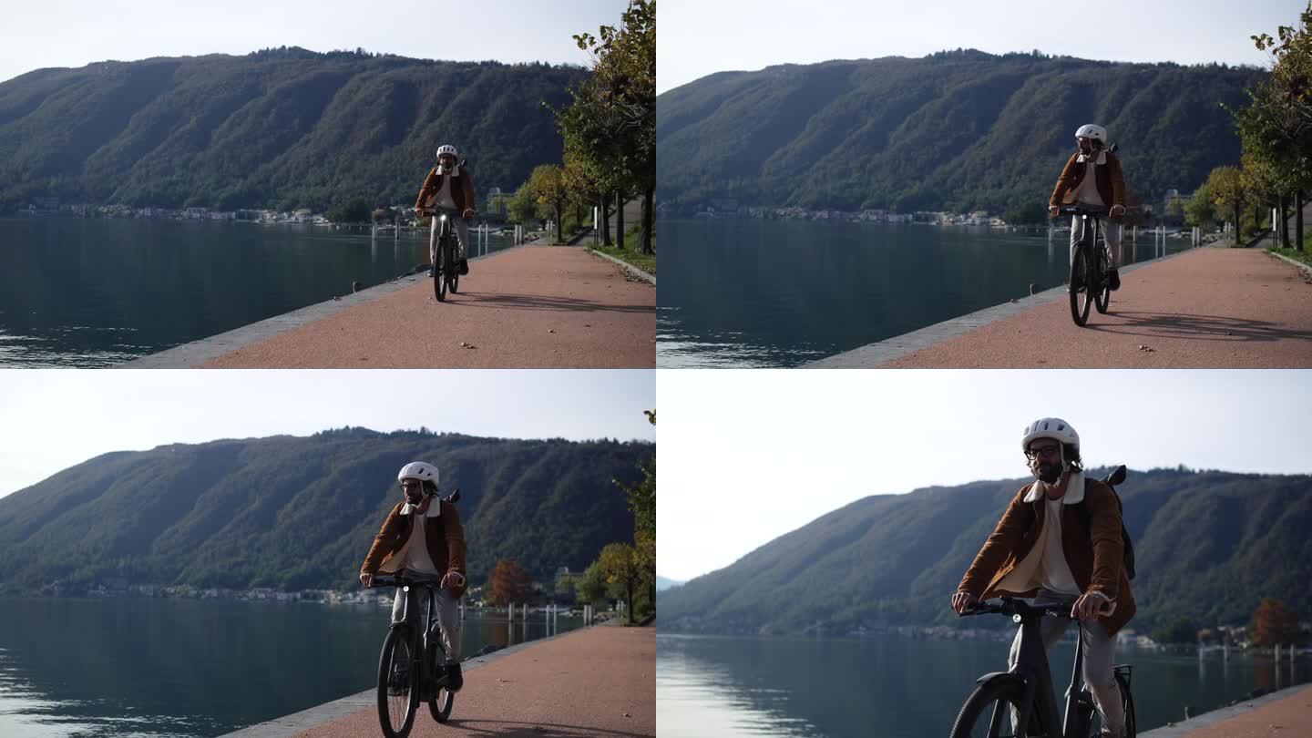 有环保意识的通勤者沿着湖边的小路骑自行车