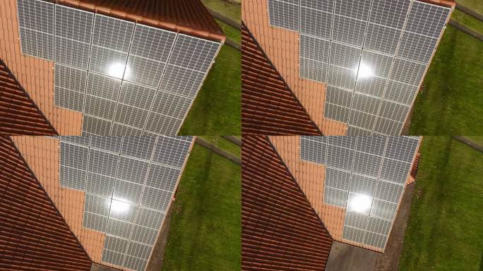 安装在屋顶上的光伏太阳能电池上的太阳眩光。