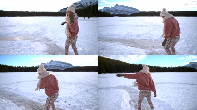 镜头:一对情侣手牵着手，在结冰的湖面上滑冰