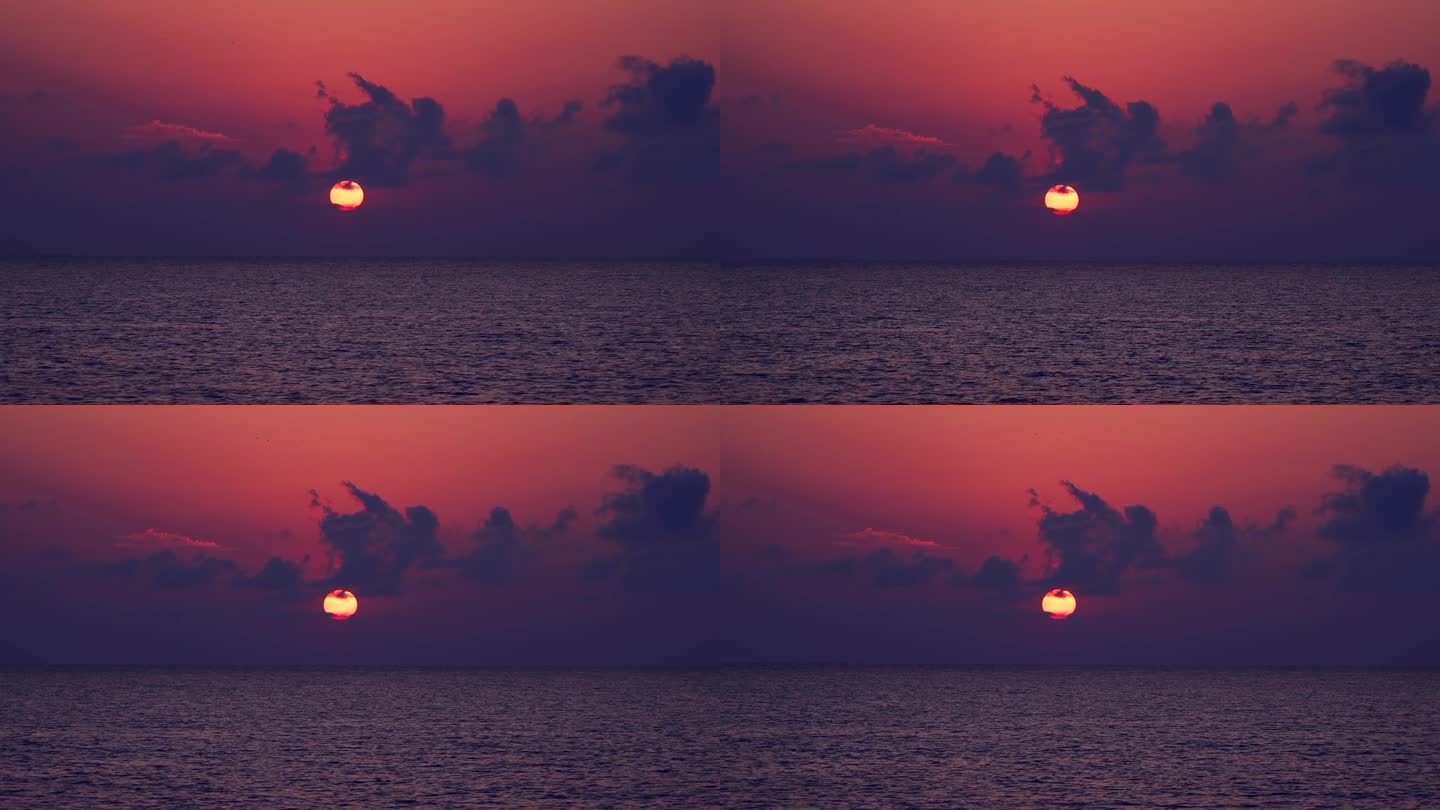 橙色和紫色调的大海上戏剧性的日落