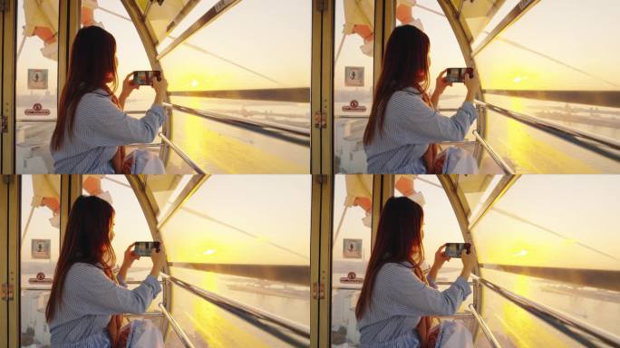日落时分，女游客在大阪码头摩天轮上欣赏美景