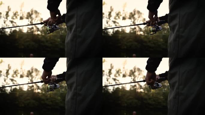 手柄旋转与卷轴的鱼竿超级慢动作。渔夫手握纺线棒的特写。旋转钓轮