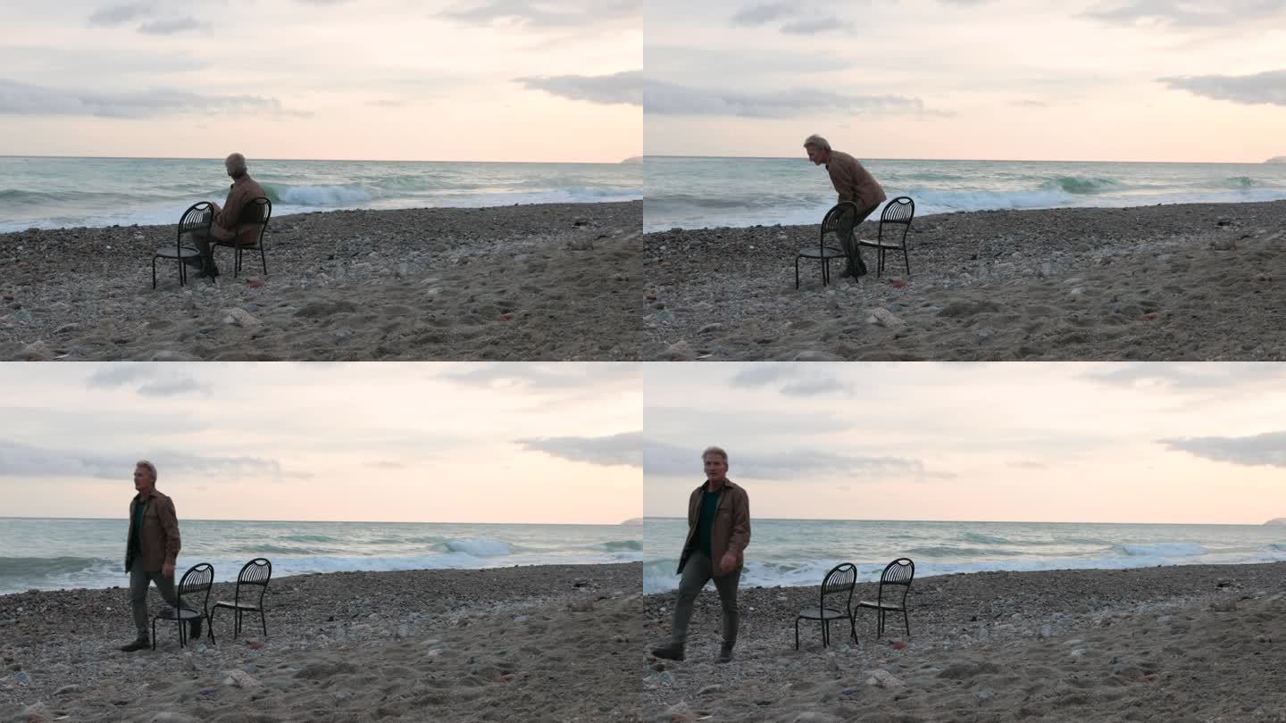 一个成熟的男人在空旷的沙滩上休息