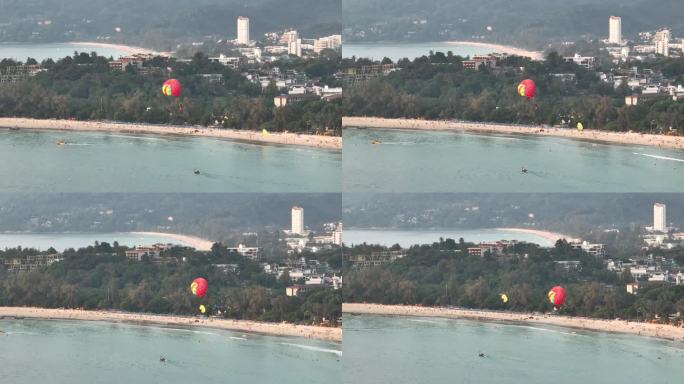 日落时间普吉岛著名的海岸线海滩湾滑翔伞乘航拍全景4k泰国