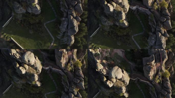 在保加利亚西北部维丁省，一架空中无人机从底部向上移动，显示了Belogradchik岩石堡垒的坚固城