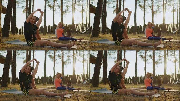 成年女性在瑜伽营训练，运动女性练习体式伸展身体