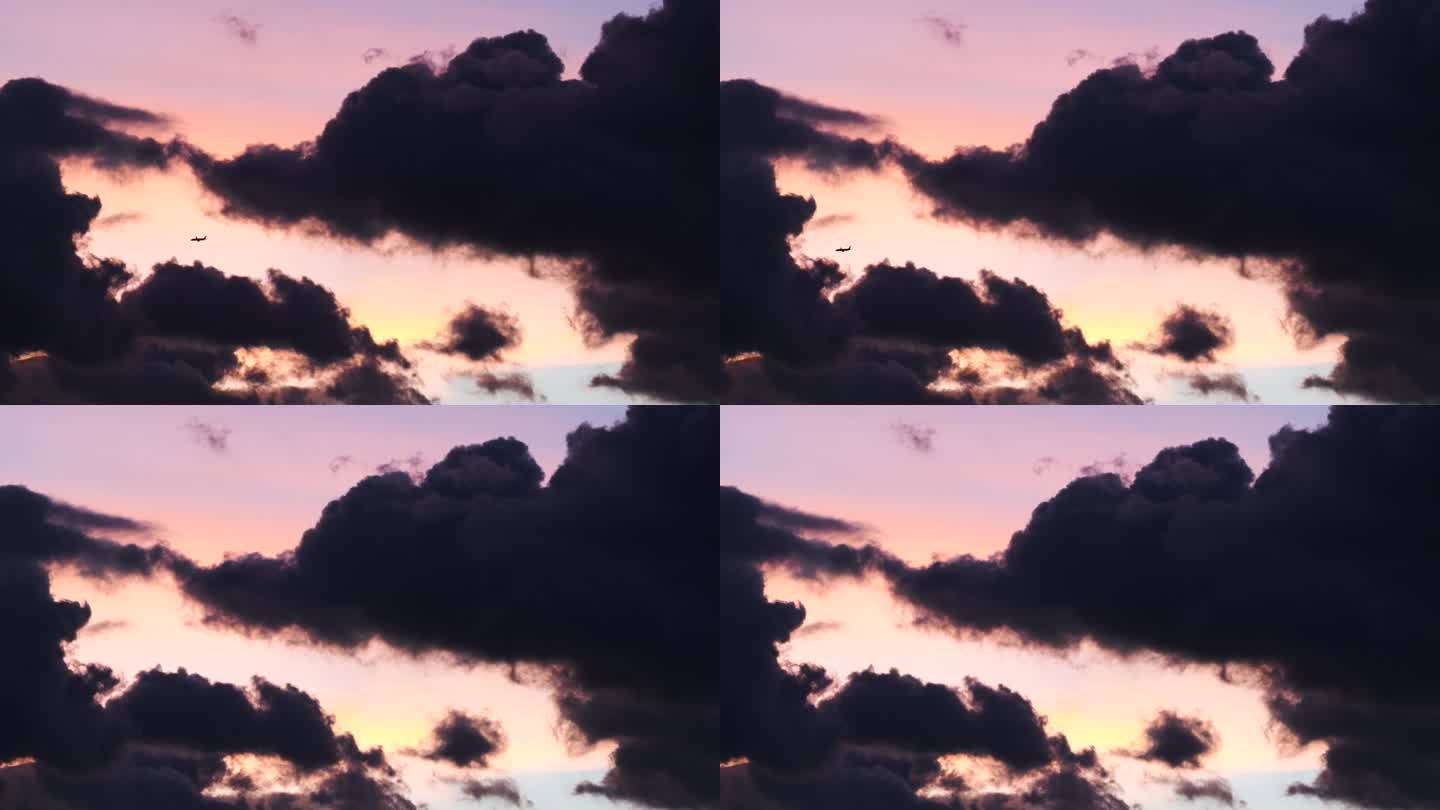 夕阳下飞机穿过乌云视频