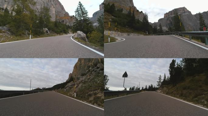 乘车观景，雄伟的山路在意大利的白云石山脉，尖峰的高山。跑车或自行车沿着意大利阿尔卑斯山雄伟美丽的山路